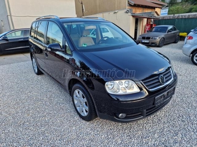 VOLKSWAGEN TOURAN 2.0 PD TDI Highline BMM MOTORKÓD BÉZS BELSŐ 7 SZEMÉLYES DIGITKLIMA ÜLÉSFŰTÉS TEMPOMAT ALUFELNI